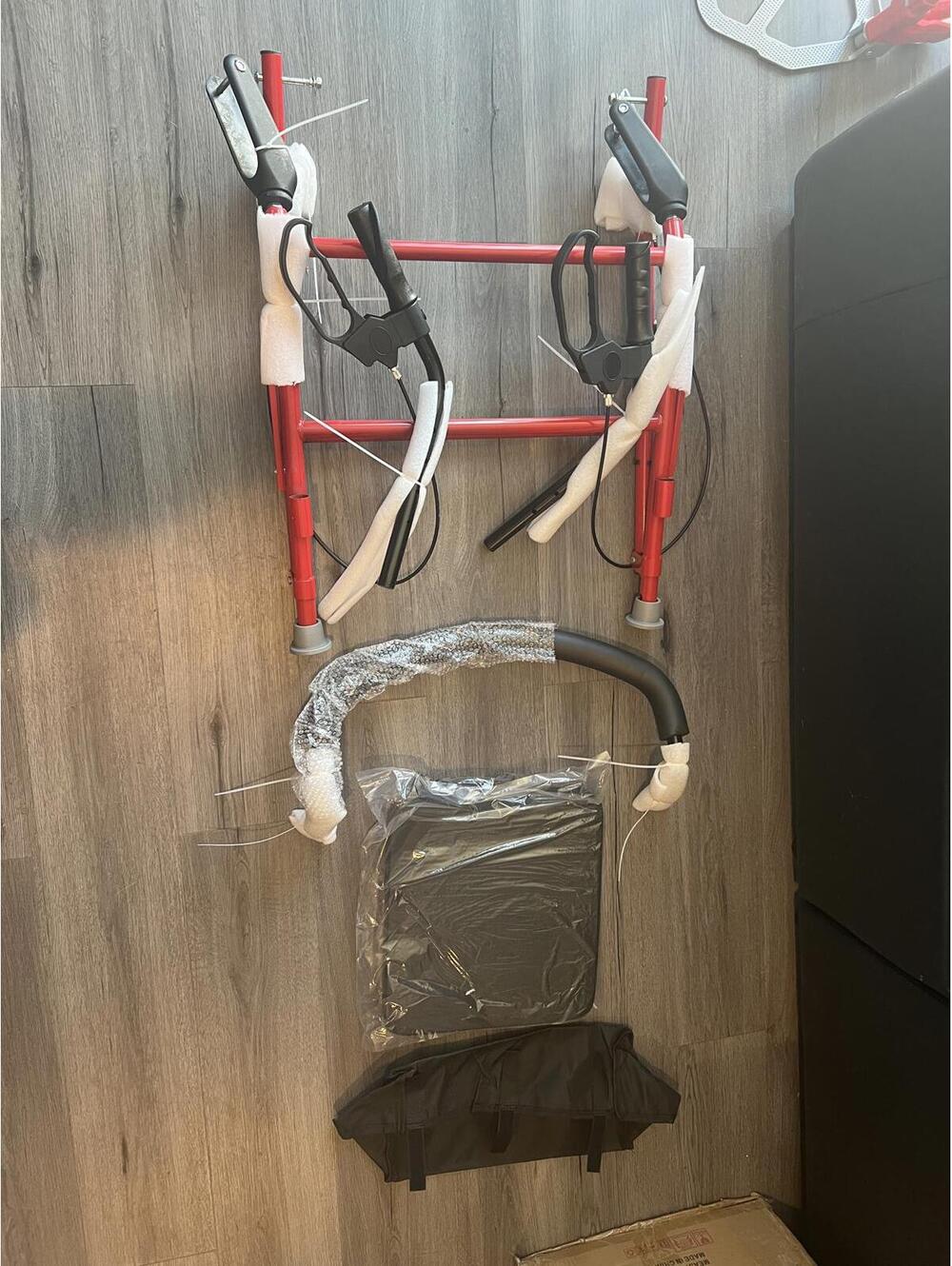 Foldable Red Walker with Seat and Carry Bag - missing wheels